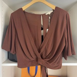 Grade&gather x Anthropologie brown wrap style blouse.